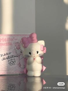 a hello kitty figurine sitting on top of a table