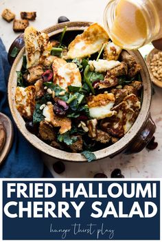 a bowl filled with fried halloui and other ingredients next to a jar of honey syrup