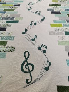 a quilt with musical notes on it