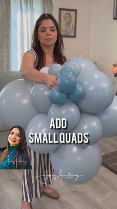 a woman is holding some balloons in front of her face with the caption add smallquads