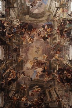 an ornate ceiling with many paintings on it