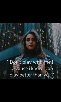 a woman standing in front of a tall building with the words don't play with me because i know i can play better than you