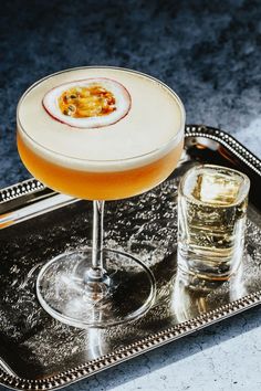 a drink sitting on top of a metal tray