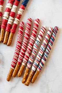 some pretzels are lined up and ready to be wrapped in candy canes