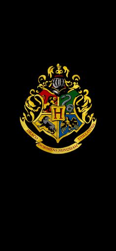 the hogwarts crest on a black background