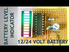 an electronic device is displayed on a board with the words battery indicator and volt meter