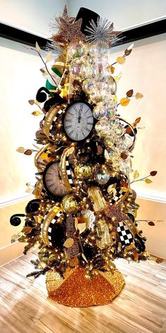 a christmas tree made out of many different types of clocks and decorations on top of it