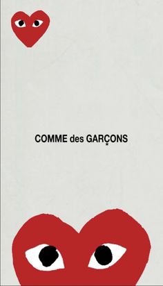 two red hearts with eyes and the words comme des garons