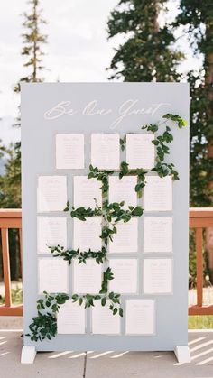 a seating chart with greenery on it