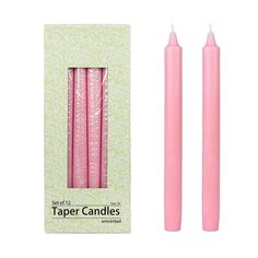 two pink candles are in the packaging