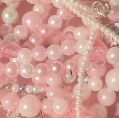 pink and white beads are on display for sale