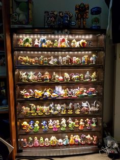 a display case filled with lots of toy figurines