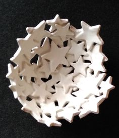 a bowl that has some white stars in it