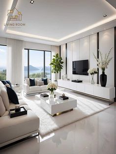 a living room filled with furniture and a flat screen tv sitting on top of a white table