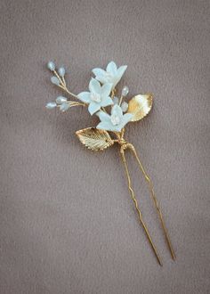 Indulge in the beauty of wild flowers with our Wildflower something blue bridal hair pin that celebrates the age old tradition. Let the delicate details and organic design transport you to a blooming meadow of wild flowers, where beauty, simplicity and the romance of nature intertwine. Like a little bouquet of flowers in your hair, this hair pin is a perfect accompaniment to romantic bridal hairstyles and bridal aesthetics. * DETAILS * > Designed and handmade in Australia. Worldwide shipping > Handcrafted from tarnish resistant jewellery wire > Featuring handcrafted clay flowers, faceted crystal beads, Czech seed beads > Individual hair pin > Colours: Gold or silver with blue or ivory details * MADE TO ORDER * The Wildflower hair pin is made to order. Please allow 2 for production plus del Blue Hair Pins, Blue Hair Accessories, Bridal Hair Pin, Something Blue Bridal, Gift For Bride, Ribbon Wrap, Blue Bridal, Hair Accessories Gift, Wedding Hair Pins