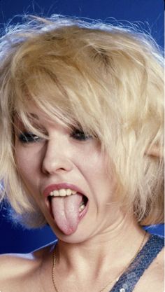 a woman sticking her tongue out and making a funny face