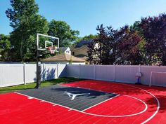 an outdoor basketball court in the backyard