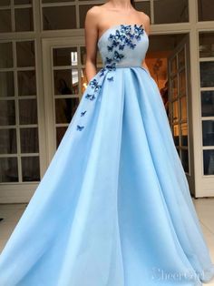 split Strapless long sky blue prom dress with pockets and butterfly applique. It can be made in other colors,please contact us 1.Silhouette:A-line 2.Fabric:Satin 3.Embellishment:Butterfly Applique 4.Neckline:Straight Across 5.Sleeve:Strapless 6.Waistline:Natural 7.Hem-length:Sweep Train 8.Back Details:Zipper 9.Fully Lined:Yes 10.Buit-In Bra:Yes 11.Boning:Yes 12.Picture Color:Sky Blue Blue Tulle Prom Dress, Sky Blue Prom Dress, Formal Ball Gown, Strapless Prom Dresses, Prom Dresses With Pockets, Blue Tulle, A Line Prom Dresses, Tulle Prom Dress, Cheap Prom Dresses