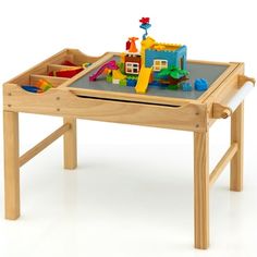 a child's wooden table with toys on it