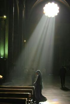 a bride and groom are sitting on pews in front of the alter at a church