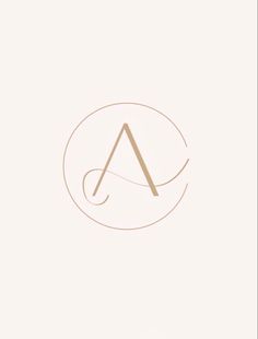 the letter a is inscribed in gold on a white background with a circle around it