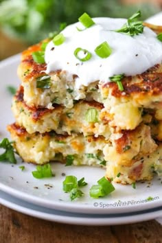 loaded mashed potato cakes with sour cream on top