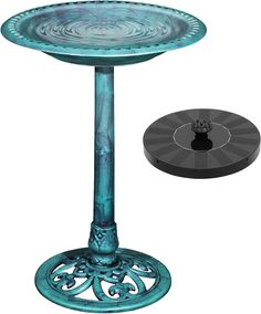 a blue pedestal with a black base and an object in the background that looks like it has been made out of metal