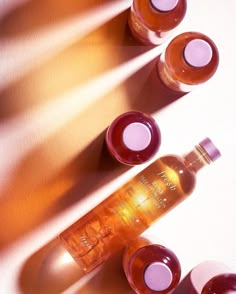 three bottles of wine sitting next to each other on top of a white countertop