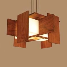 an overhead view of a wooden light fixture with square and rectangle shaped lightshades