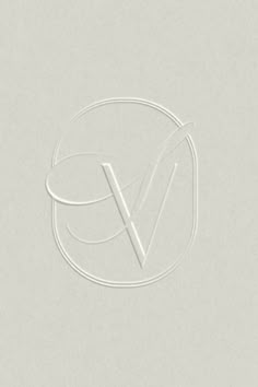 a white logo with the letter v on it