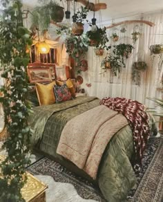 a bed room with a neatly made bed and lots of plants