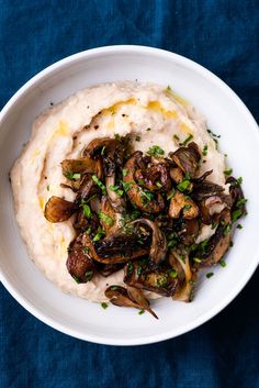 white bean puree with garlic mushrooms served on mashed potatoes