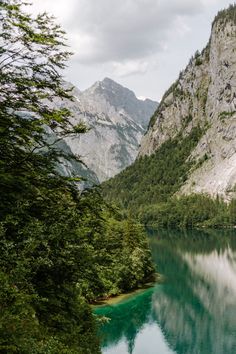 a lake surrounded by mountains and trees