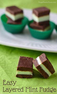 easy layered mint fudge desserts on a white plate with green napkin and cupcakes in the background