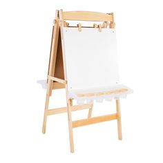 a wooden easel with an empty white canvas on the bottom and two trays below it