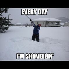 a man standing in the snow holding a baseball bat with words on it that say every day i'm shovelin