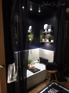 a bath room with a tub and a mirror