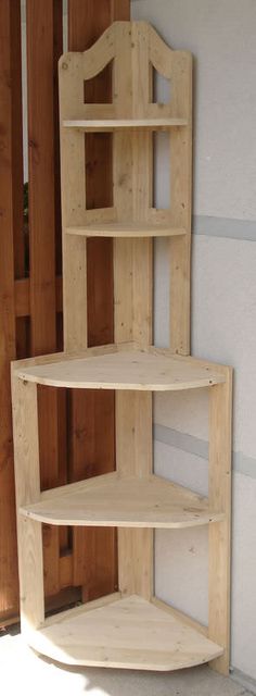 three wooden shelves sitting next to each other