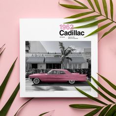 a pink car parked in front of a palm tree