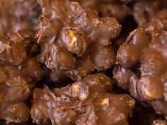 close up view of chocolate clusters with nuts in the middle