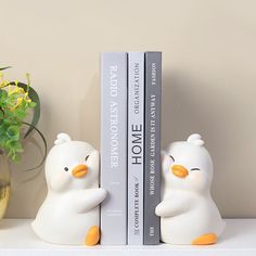 two bookends made to look like they are hugging