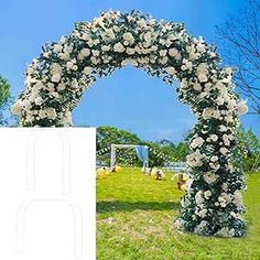 a large white flowered arch in the middle of a field