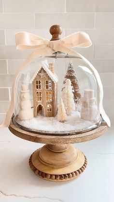 a snow globe with a house in it