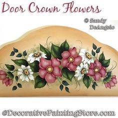 a sign with flowers painted on it and the words door crann flowers above it