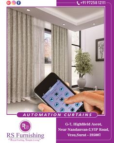 a person holding an iphone in front of a window with curtains on the windowsill