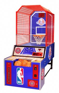 an arcade machine with basketballs in it