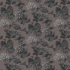 a black and white flower pattern on a brown background