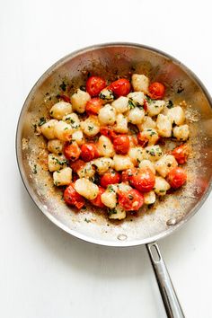 a pan filled with food on top of a white table