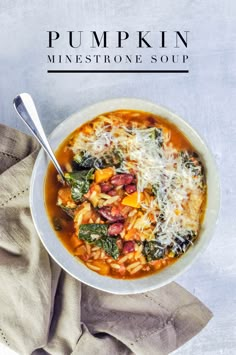 a bowl of pumpkin minestone soup with spinach and cheese