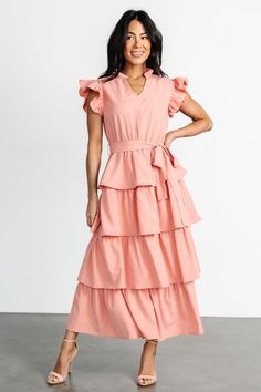 Chrysanthi Tiered Dress | Dusty Coral Spring Flutter Sleeve Maxi Dress With Tie Waist, Feminine Tie Waist Maxi Dress For Brunch, Pink Chic Maxi Dress With Flutter Sleeves, Feminine Maxi Dress With Tie Waist For Brunch, Chic Pink Maxi Dress With Ruffle Hem, Chic Pink Belted Maxi Dress, Chic Maxi Dress With Flutter Sleeves And Tie Waist, Chic Maxi Dress With Tie Waist And Flutter Sleeves, Feminine Belted Maxi Dress